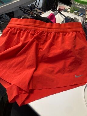 Like new bright red Nike running shorts size M
